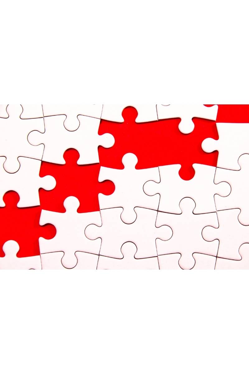 Red and white puzzle missing pieces.