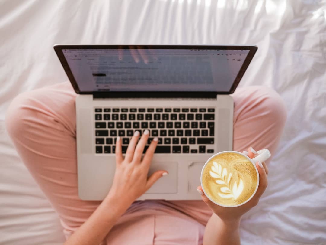 laptop on woman's lap