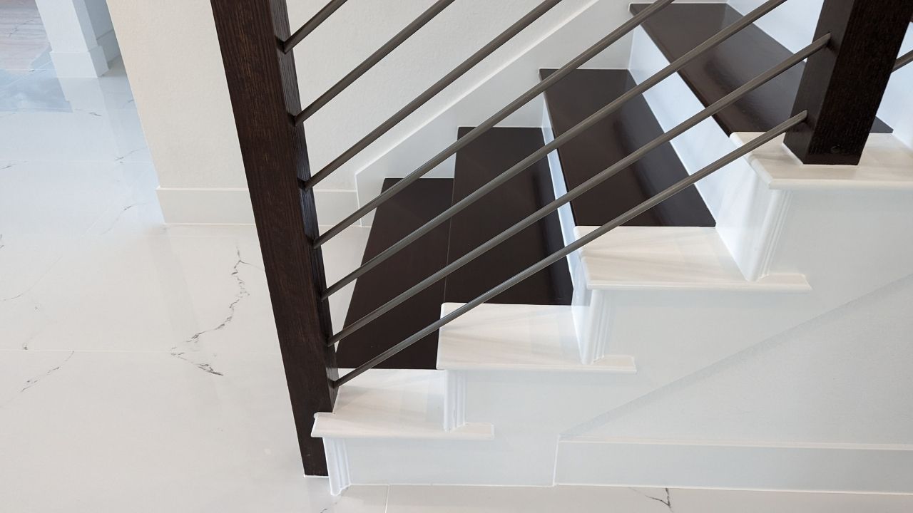 Flooring using 24x24 Iceland White Porcelain Tile next to a staircase