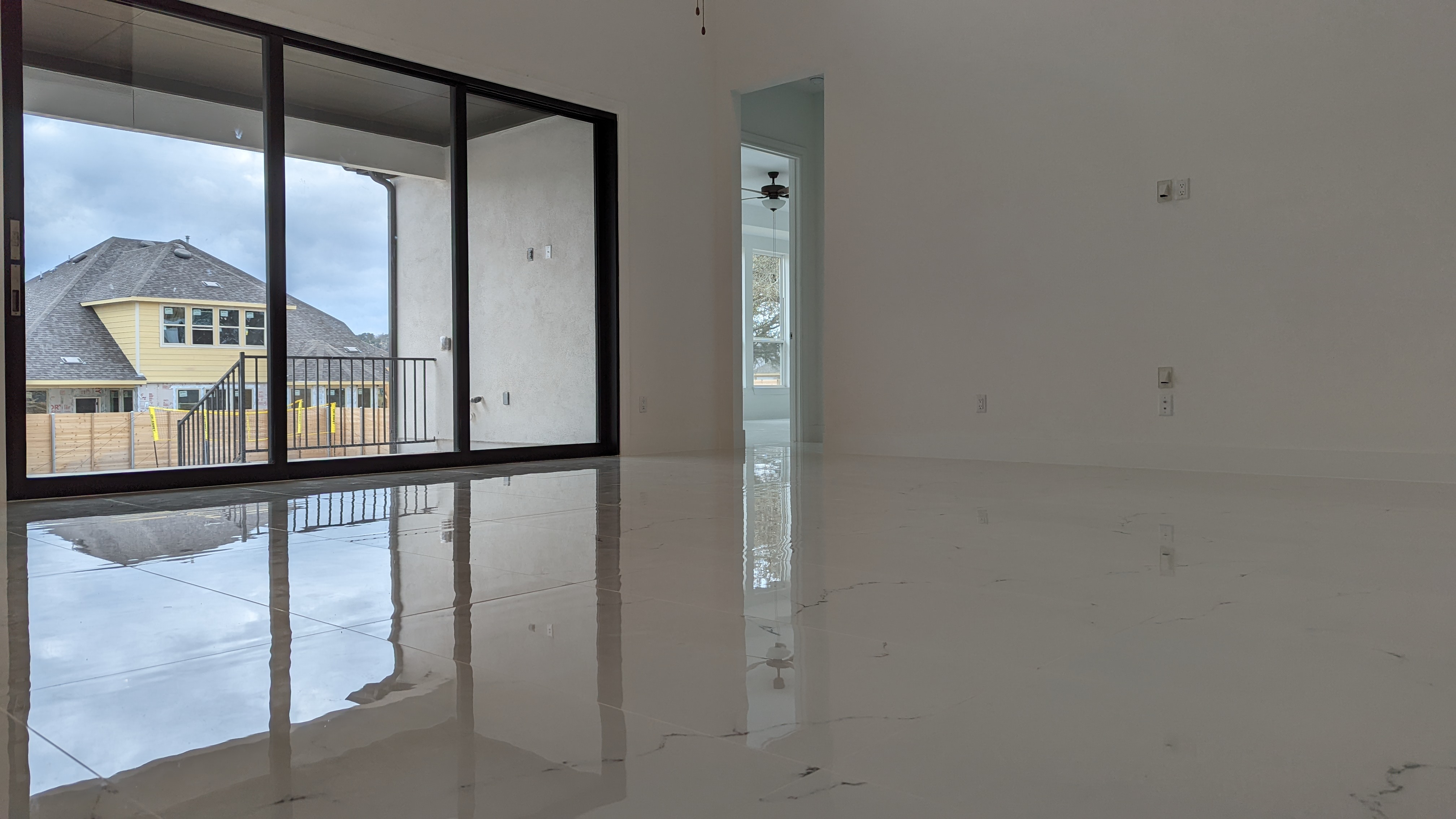 24x48 Iceland White Porcelain Tile In A Family Room